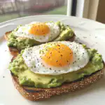 Avocado toast with eggs served on whole grain bread