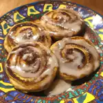 Cinnamon Roll Pancakes stacked with glaze