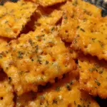 Cheddar jalapeño sourdough crackers on parchment