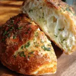 garlic and herb sourdough bread with golden crust
