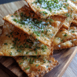 Easy sourdough discard crackers on rustic tray