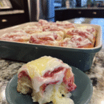 Freshly baked raspberry lemon sourdough rolls with frosting